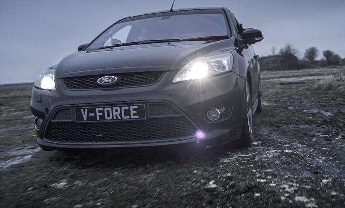 Evasive Driving in a black Ford Focus on gravel